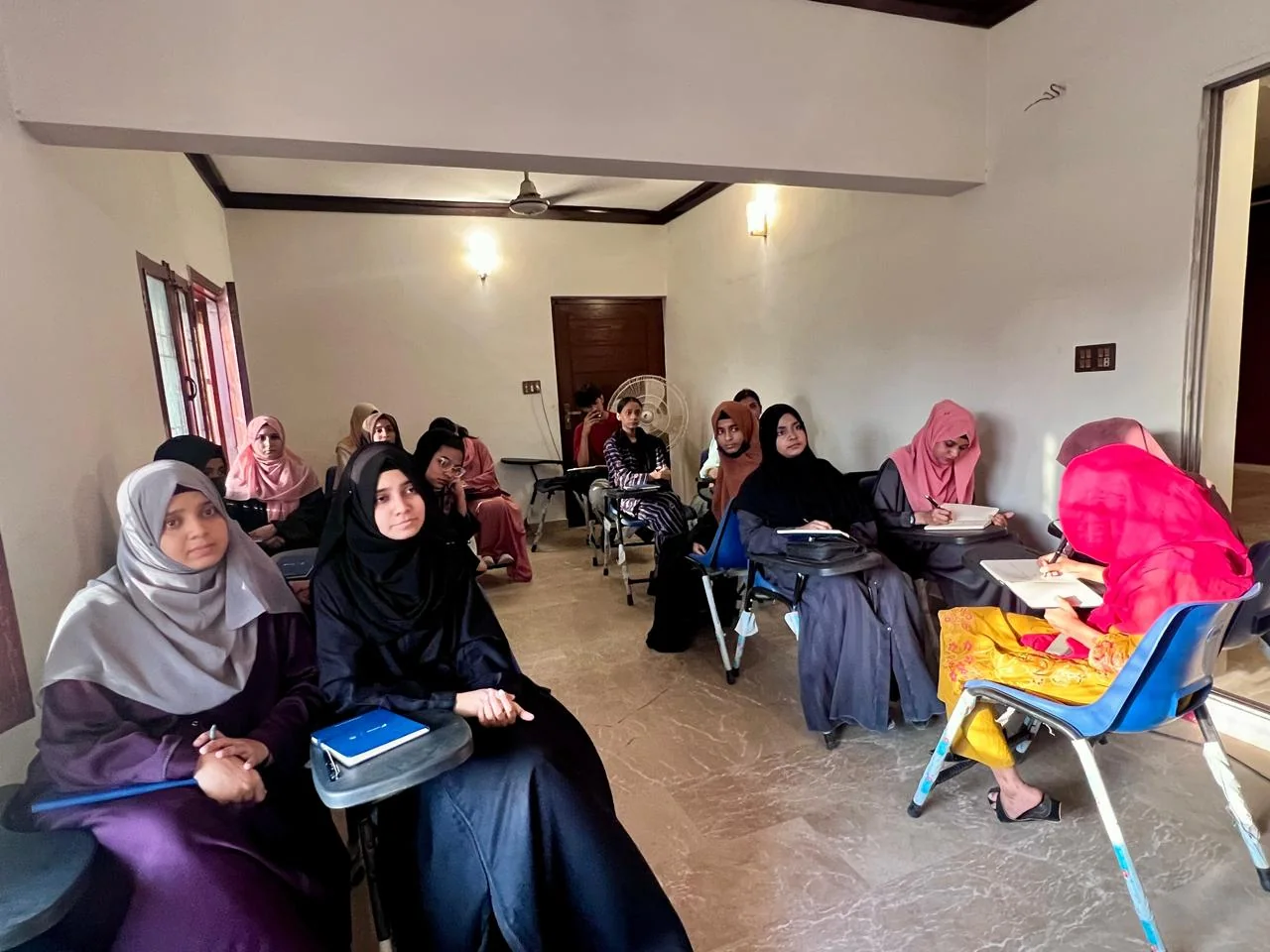 SOCH students seated with notebooks during a classroom session in Karachi.