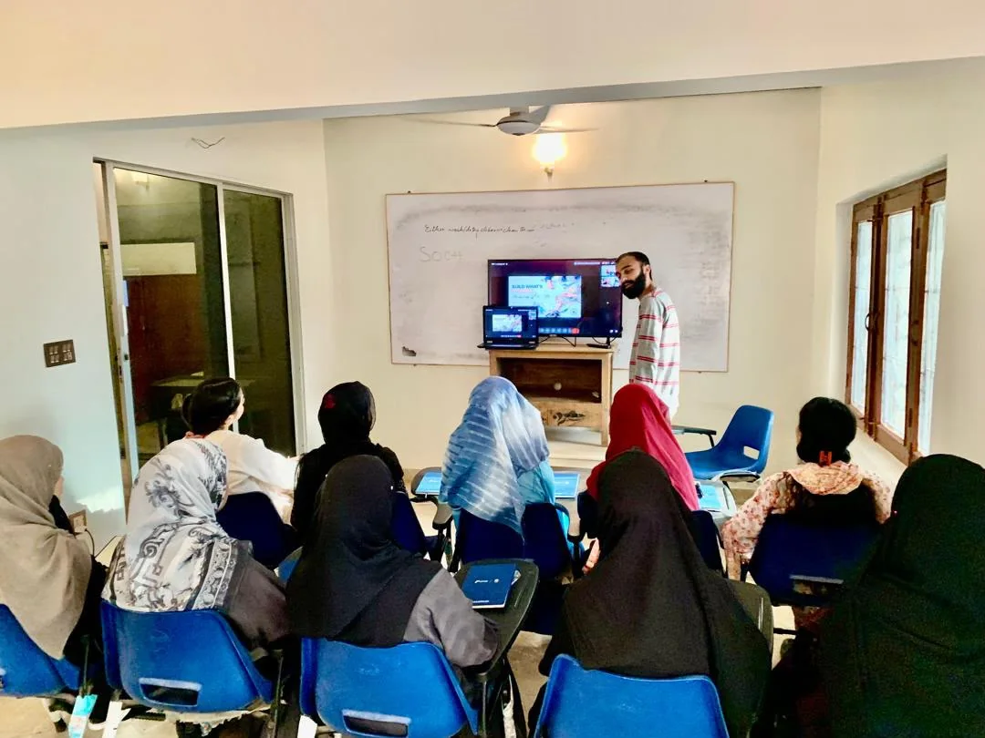 SOCH instructor presenting to students during a classroom session in Karachi.